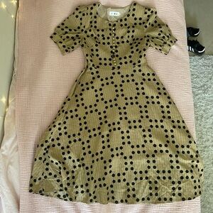 Elegant 50’s style tan dress. Tag says M but fits like S. Great condition.